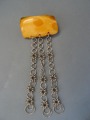 Brooch, amber with three chains 12.5gr.