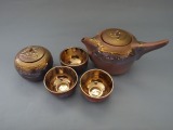 Ceramic tea set 5. items, one cup with a defect
