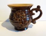 Ceramic vase with handle. Daiļrāde