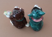 Spice jars, a pair of pigs with flowers, h 9 cm, 2 pieces.