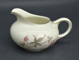 Porcelain ivory cream jug. Europe. Decoll. 8x14x10 cm