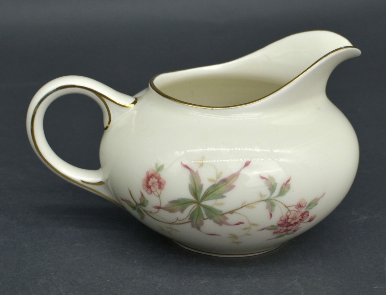 Porcelain ivory cream jug. Europe. Decoll. 8x14x10 cm