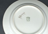 Painted plate with a folk motif. H. Krisone. 15.5 cm