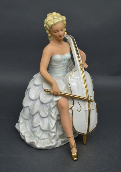 Porcelain figurine Cellist. Wahlendorf, Germany. H 23 cm.