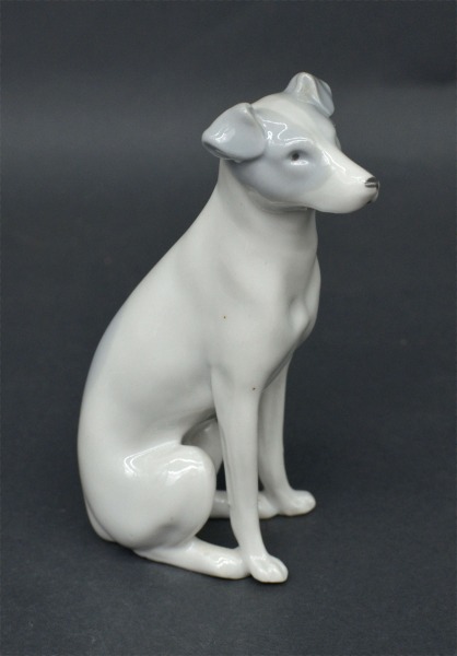 Porcelain figure Dog. Early 20th century. 10 cm