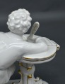 Porcelain Writing young man. 1950s. H14 cm. Restored feather.