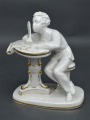 Porcelain Writing young man. 1950s. H14 cm. Restored feather.