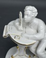 Porcelain Writing young man. 1950s. H14 cm. Restored feather.