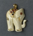 Кулон из кости с золотой отделкой и искусственными камнями. 2,8x2,4x0,5 cм