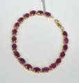 Zelta aproce ar rubīniem. Zelts 14 k. Garums 19,2 cm. Svars 9,18 g