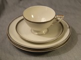 Kuznetsov tea trio with an additional dessert plate. 1930s. Latvia. 9 cm, 14 cm, 19 cm. With defect
