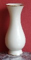 A creamy-white color vase with golden edge