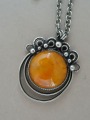 Pendant with amber on chain. Silver, signature Lāme.