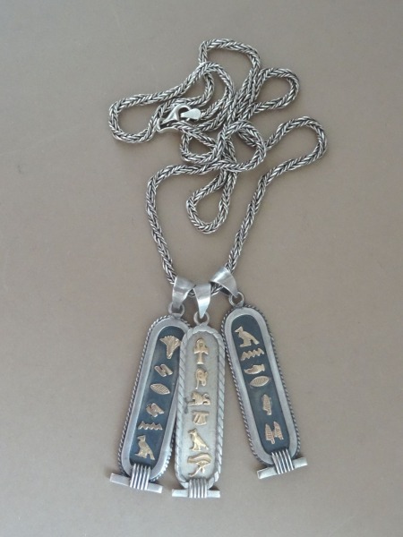 Egyptian silver amulets on a chain. Silver gold