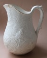 White pitcher. Faience.